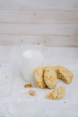 Oatmeal carrot cookies with nuts and milk close up selective focus