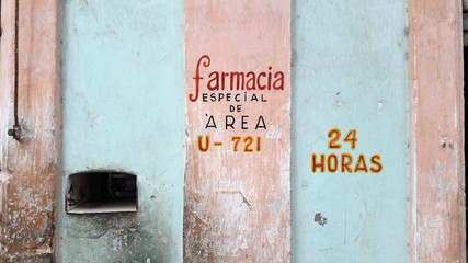 Hand written signing on building in Cuba