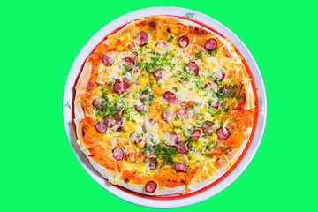 hot tasty fresh pizza on a plate close-up. green background