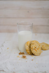 Oatmeal carrot cookies with nuts and milk close up selective focus