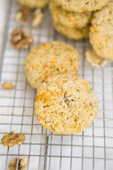 Oatmeal carrot cookies with nuts and milk close up selective focus