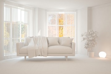 White stylish minimalist room with sofa and autumn landscape in window. Scandinavian interior design. 3D illustration
