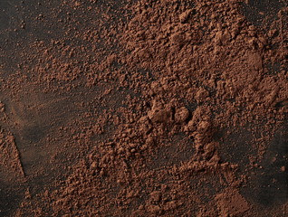 Cocoa powder isolated on black background and texture