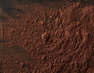 Cocoa powder isolated on black background and texture