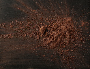 Cocoa powder isolated on black background and texture