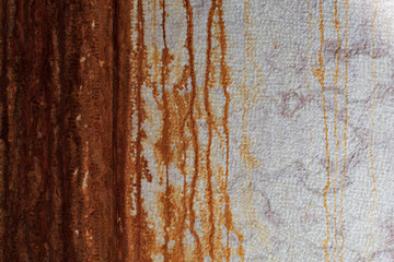 Wall with rust runoff, can be used as a background.