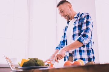 Tired man cooking lunch for family and guests