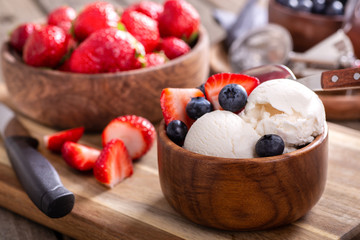 Bowl of Vanilla Ice Cream With Blueberries and Strawberries