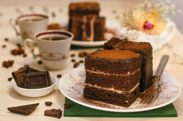 Still life on the table. Sweet cake and a hot drink . chocolate cake .
