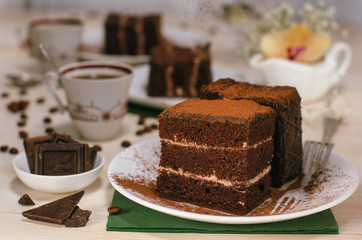 Still life on the table. Sweet cake and a hot drink . chocolate cake .