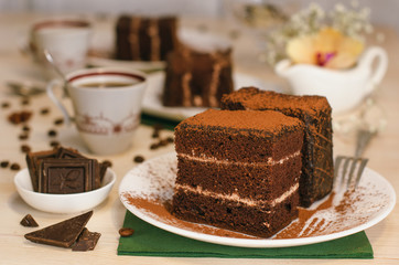 Still life on the table. Sweet cake and a hot drink . chocolate cake .