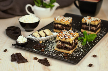 Still life on the table. Sweet cake grated pie and a hot drink .
