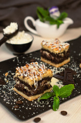 Still life on the table. Sweet cake grated pie and a hot drink .
