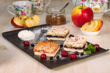 Still life on the table. Sweet cake and a hot drink .