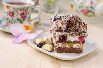 Still life on the table. Sweet cake and a hot drink .
