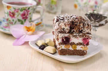 Still life on the table. Sweet cake and a hot drink .