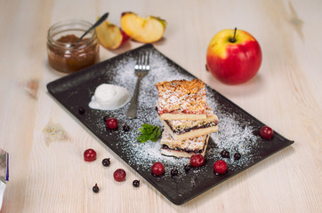 Still life on the table. Sweet cake and a hot drink .