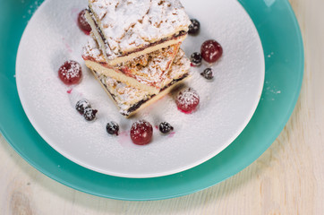 Still life on the table. Sweet cake and a hot drink .