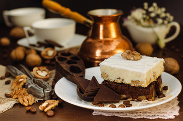 Still life on the table. Sweet cake and a hot drink .