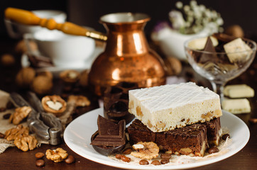 Still life on the table. Sweet cake and a hot drink .