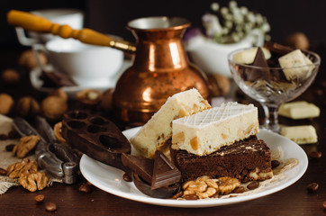 Still life on the table. Sweet cake and a hot drink .