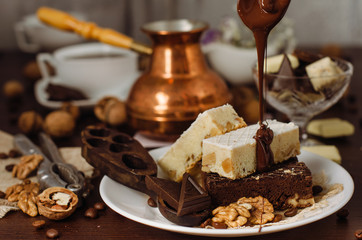 Still life on the table. Sweet cake and a hot drink .