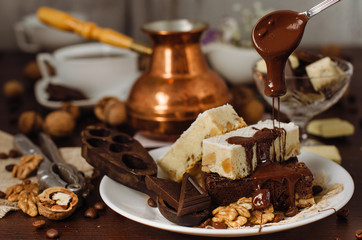 Still life on the table. Sweet cake and a hot drink .