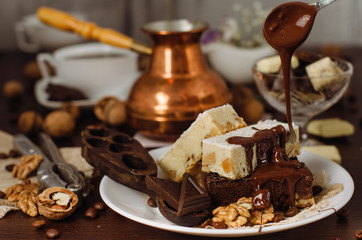 Still life on the table. Sweet cake and a hot drink .