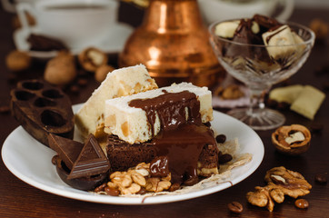 Still life on the table. Sweet cake and a hot drink .