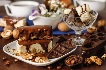 Still life on the table. Sweet cake and a hot drink .