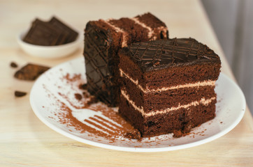 Still life on the table. Sweet cake and a hot drink . chocolate cake .