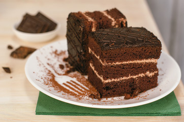 Still life on the table. Sweet cake and a hot drink . chocolate cake .