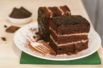 Still life on the table. Sweet cake and a hot drink . chocolate cake .