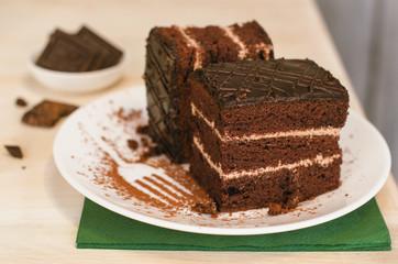 Still life on the table. Sweet cake and a hot drink . chocolate cake .