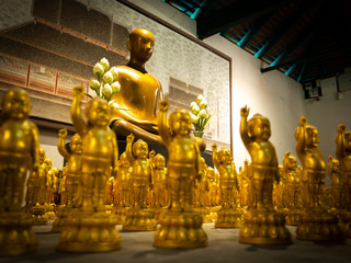 Buddha Statues in The Children Surround The Modern Art of Golden Buddha Statue