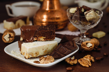 Still life on the table. Sweet cake and a hot drink .