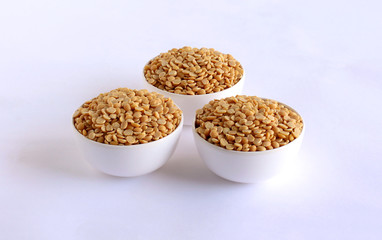 Toor dal or pigeon pea is a common Indian ingredient, which is used in food items like sambar, in bowls.