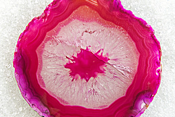 cross-section of pink agate crystal on a sugar
