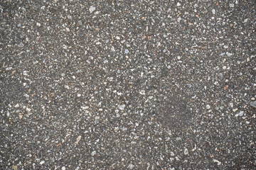 destructed tar road in a town