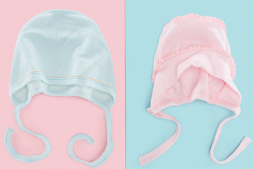 top view of pink and blue bonnets on pastel and colorful background