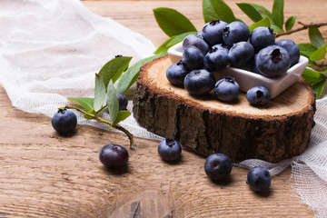 Fresh organic berries on a wooden background.