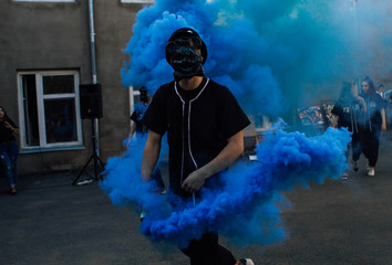the guy with the blue smoke bomb