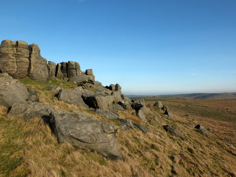 panoramic view of a large rugged gritstone outcrop at the bridestones a large rock formation in west yorkshire near todmorden