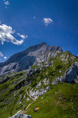 Fototapeta na wymiar Hiking trail seen from the summit in the German Alps