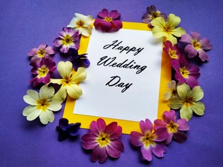 The inscription Happy Wedding Day with flowers on a colored background