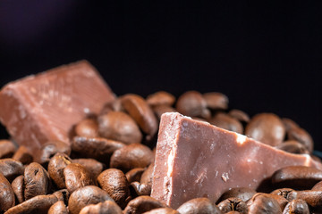 coffee grain and chocolate on dark background, close up
