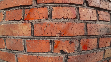 close-up of the brick wall of the red brick, view with spherical geometry - fish eye, cement mortar between bricks 