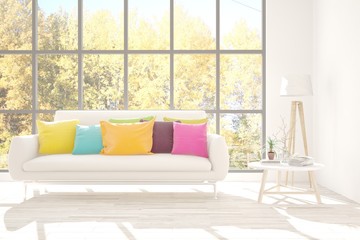 White stylish minimalist room with sofa and autumn landscape in window. Scandinavian interior design. 3D illustration