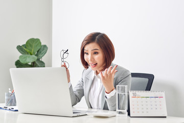 Euphoric and surprised winner online watching a laptop at office, Beautiful young woman glad and...