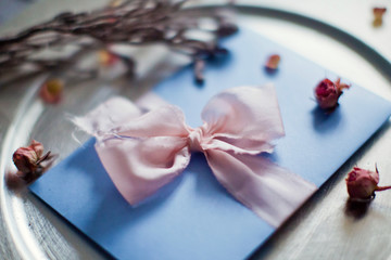 blue envelope with silk ribbon